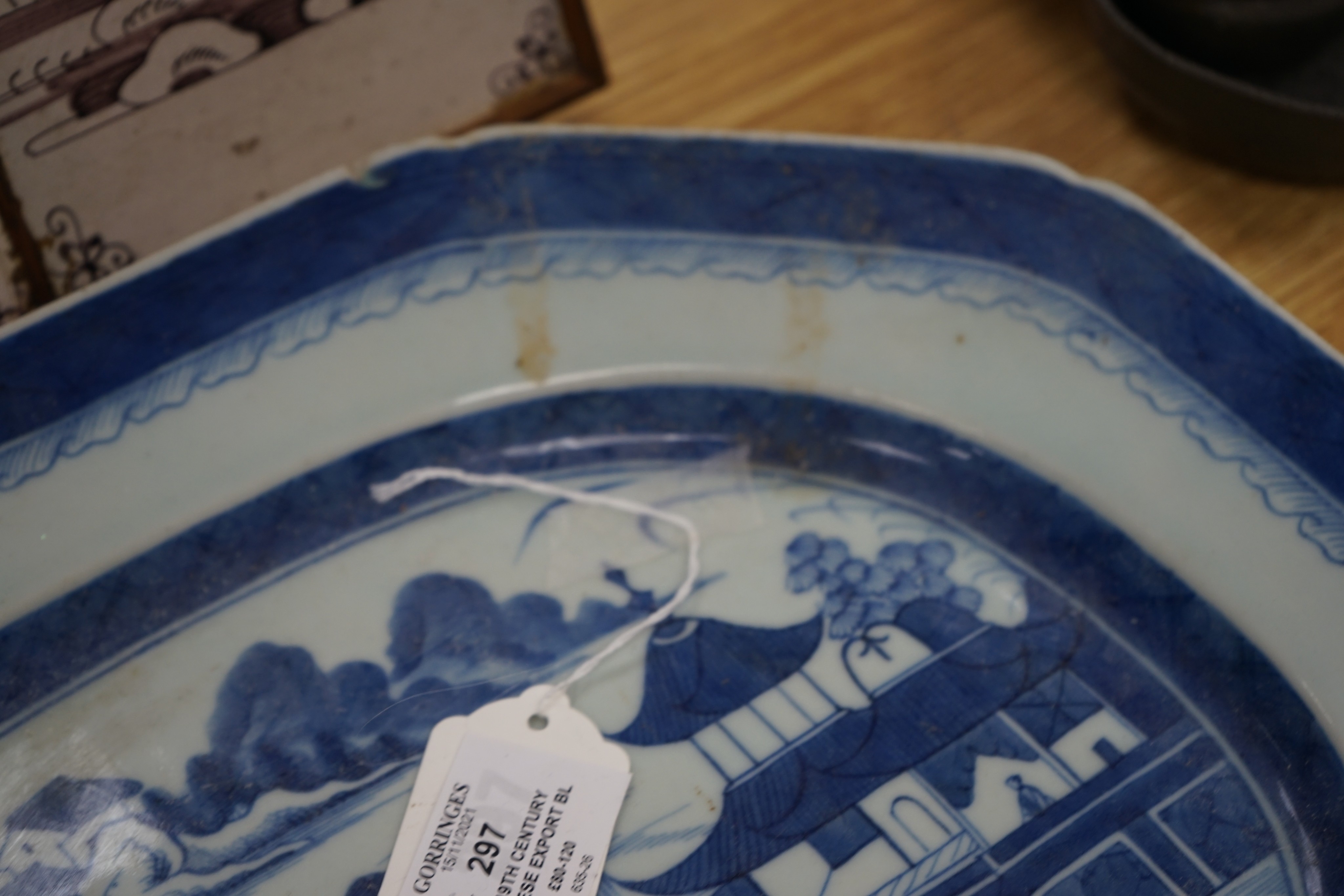 A 19th century Chinese Export blue and white octagonal meat dish, decorated with a lake scene, W 42cm